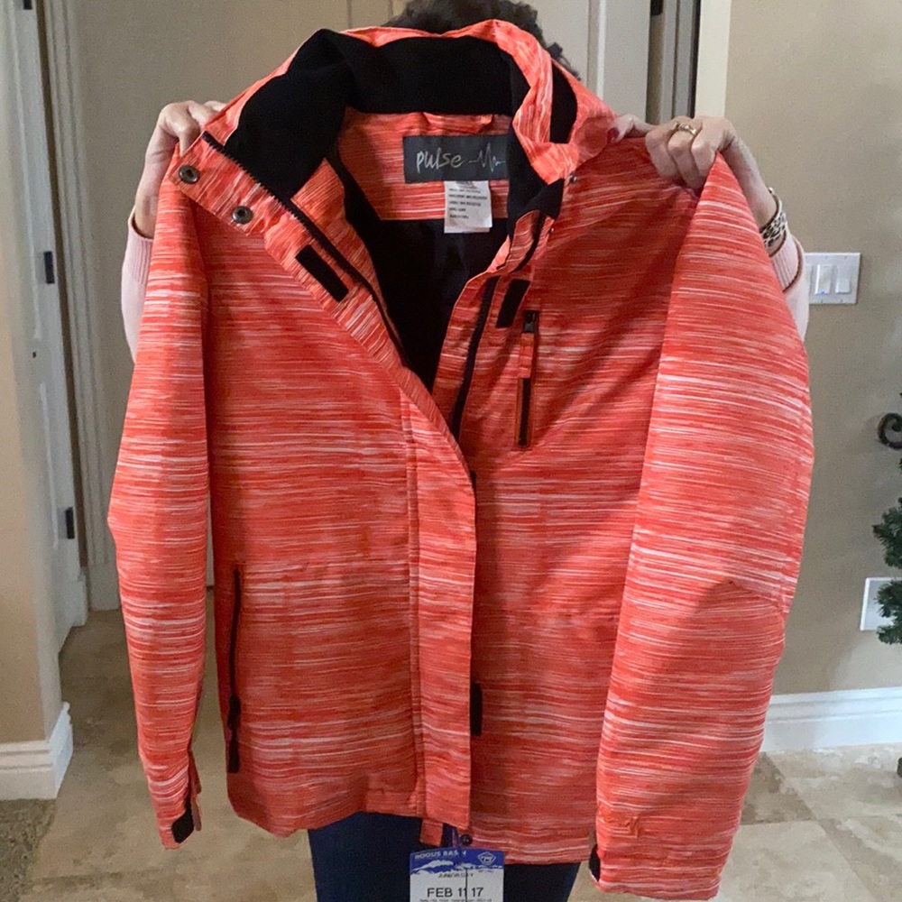 White and orange ski jacket